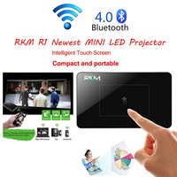 RKM R1 Newest MINI LED Projector DLP 32G HDMI IN Keystone Correction 5000mA battery touch pad for smart Home Theater Cinema