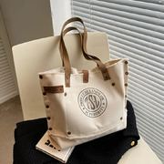 Fashionable Canvas Letter Shoulder Bag: A Stylish and Spacious