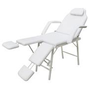 White treatment chair with ajustable legrests